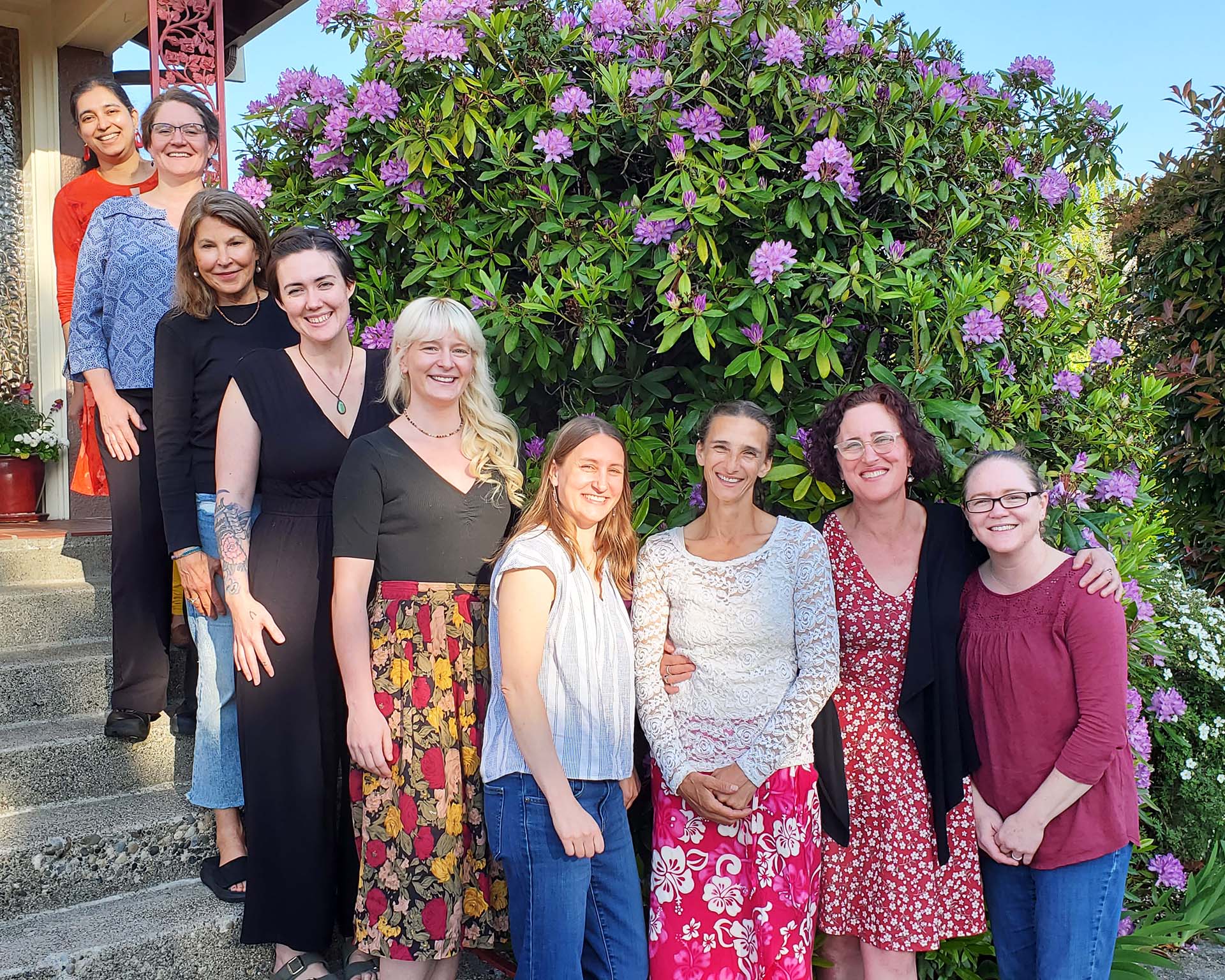 midwives in front of house