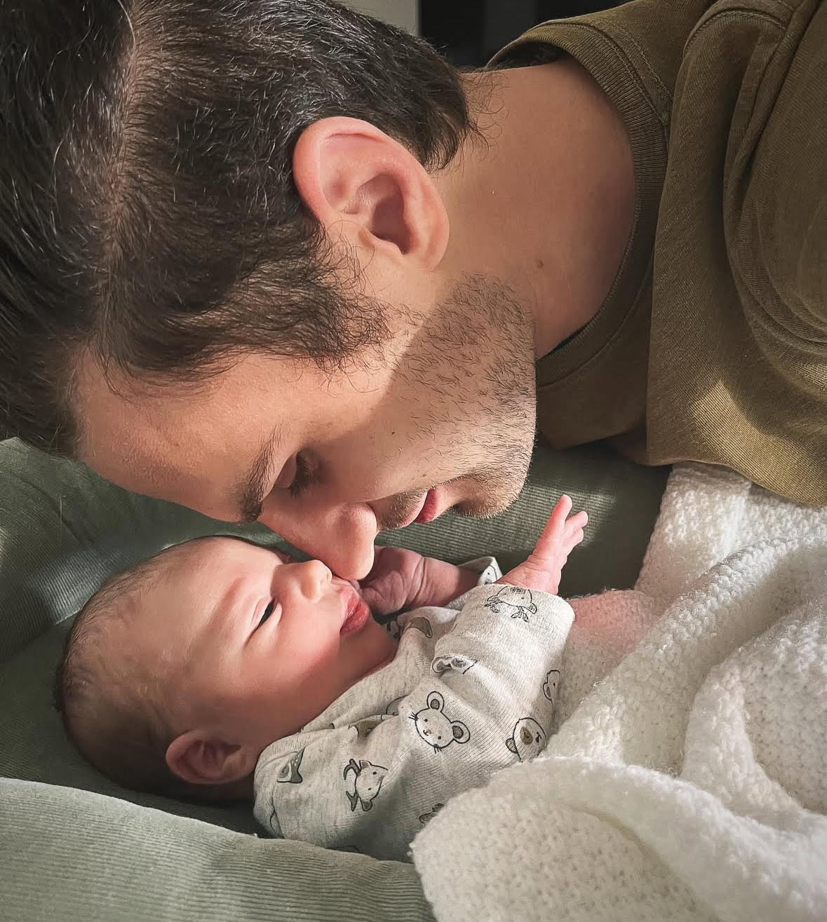 Father and child touch noses